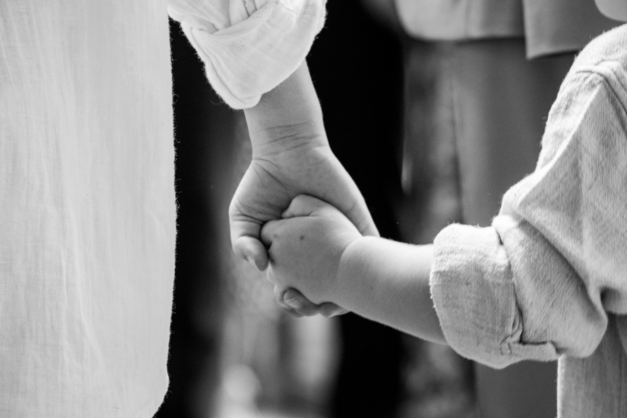 Bride and groom holding hands at London wedding